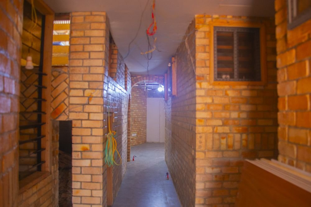 A brick hallway at Dzidzor (Joy) Hostel